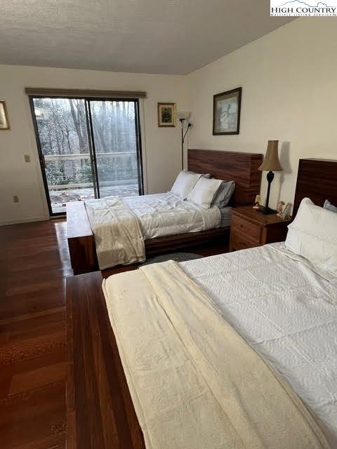 114 Lady Slipper Loop Newland, NC 28657 - Photo 21 of 50 a bedroom with two beds and a large window