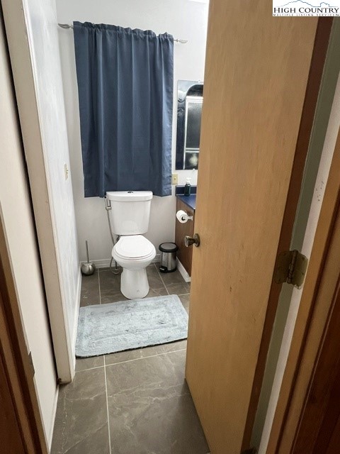 114 Lady Slipper Loop Newland, NC 28657 - Photo 24 of 50 a bathroom with a granite countertop sink and a toilet