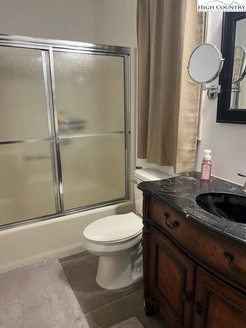114 Lady Slipper Loop Newland, NC 28657 - Photo 35 of 50 a bathroom with a granite countertop toilet sink and a shower