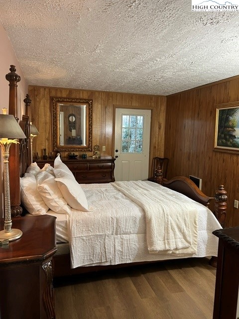 114 Lady Slipper Loop Newland, NC 28657 - Photo 37 of 50 a bedroom with a bed and a night stand