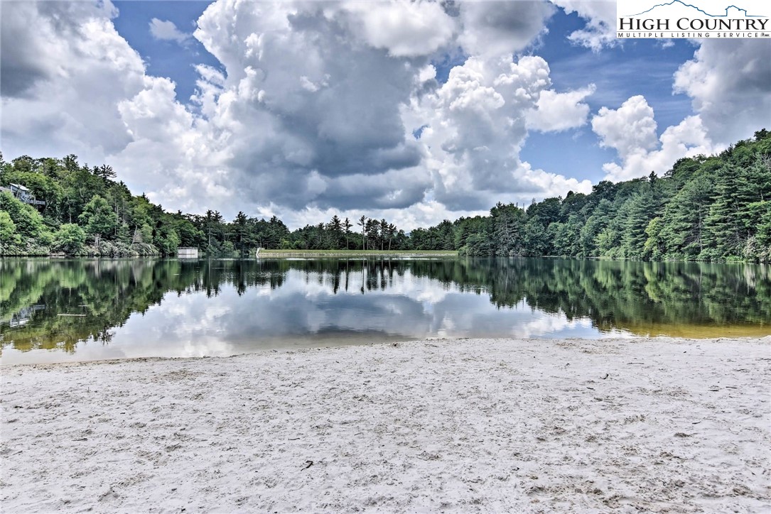 114 Lady Slipper Loop Newland, NC 28657 - Photo 45 of 50 a view of a lake with houses in the background