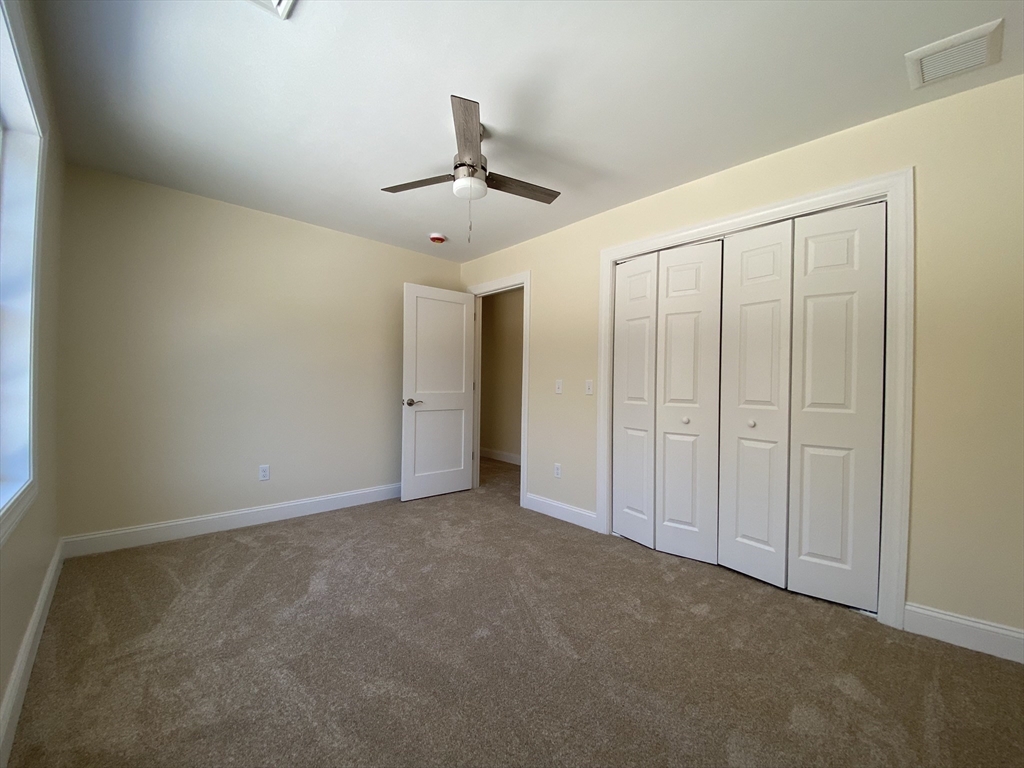 855 County Street, Unit 2 Attleboro, MA 02703 - Photo 19 of 27 an empty room with fan hallway and closet area