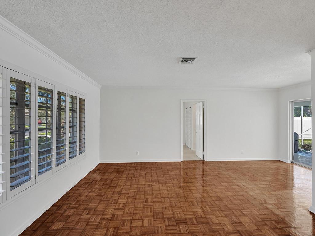 998 Southwest 5th Street Boca Raton, FL 33486 - Photo 17 of 55 a view of empty room with wooden floor and fan