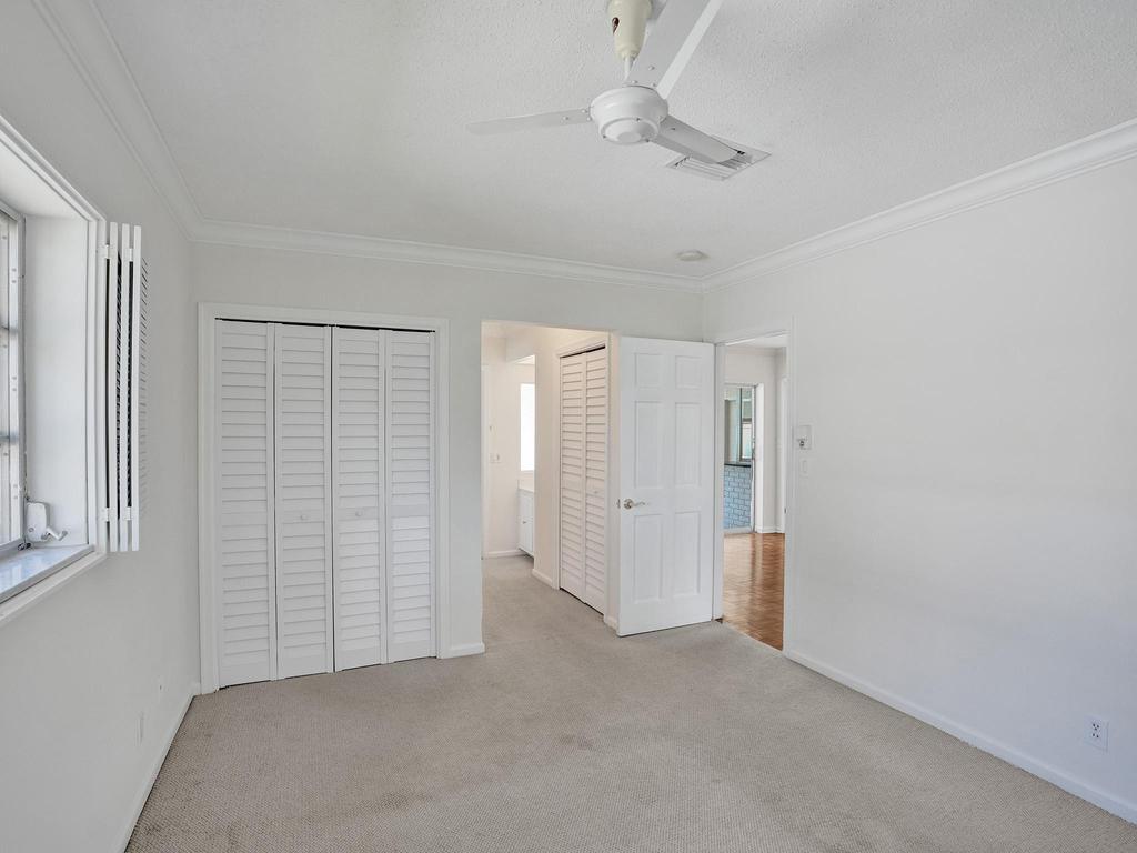 998 Southwest 5th Street Boca Raton, FL 33486 - Photo 24 of 55 an empty room with a ceiling fan and window
