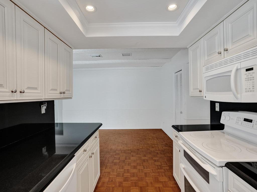 998 Southwest 5th Street Boca Raton, FL 33486 - Photo 29 of 55 a kitchen that has a sink and a stove