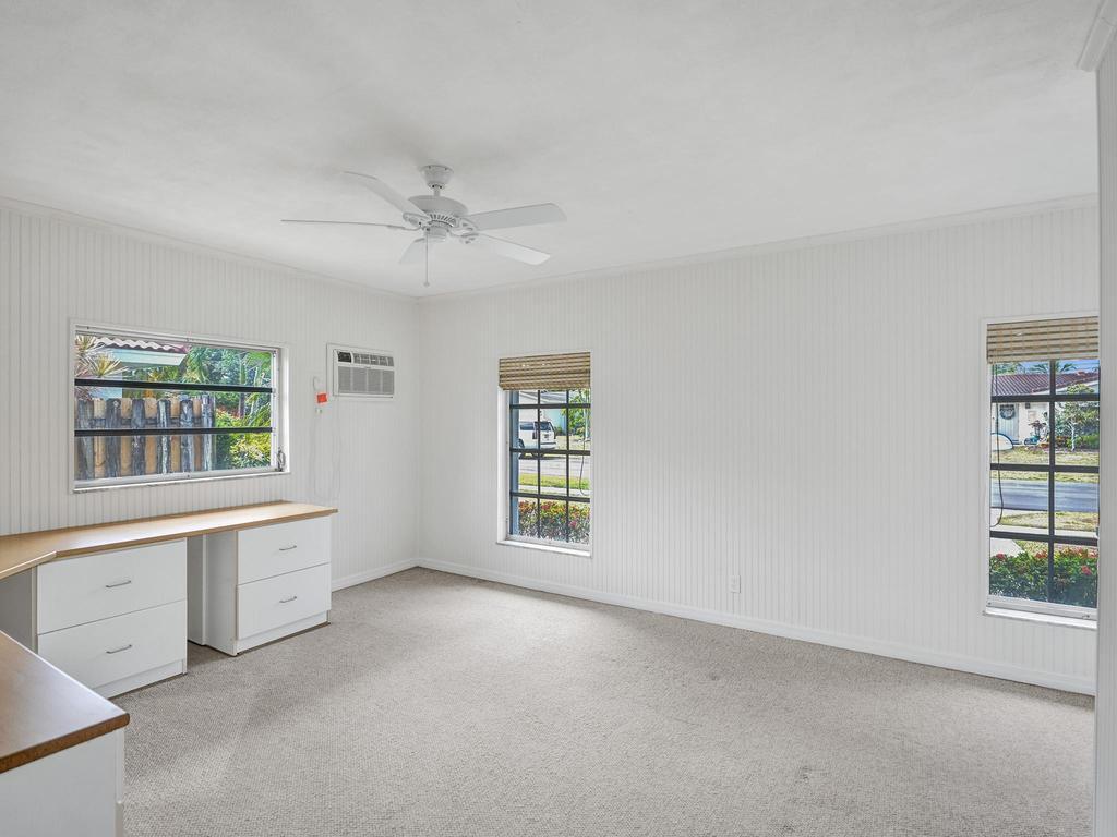 998 Southwest 5th Street Boca Raton, FL 33486 - Photo 43 of 55 an empty room with windows and cabinet