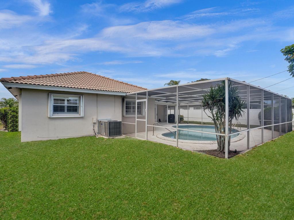 998 Southwest 5th Street Boca Raton, FL 33486 - Photo 54 of 55 a house view with a garden space