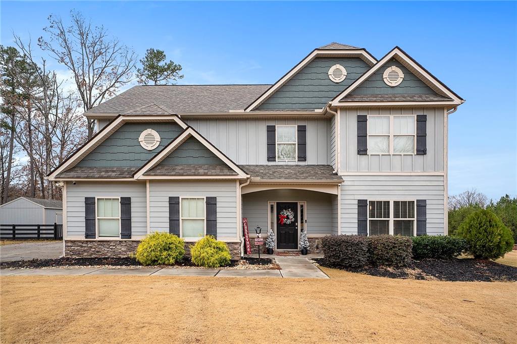 46 Foothills Parkway Northeast Rydal, GA 30171 - Photo 1 of 1 a front view of a house with a yard