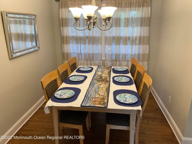 a living room with furniture and a lamp