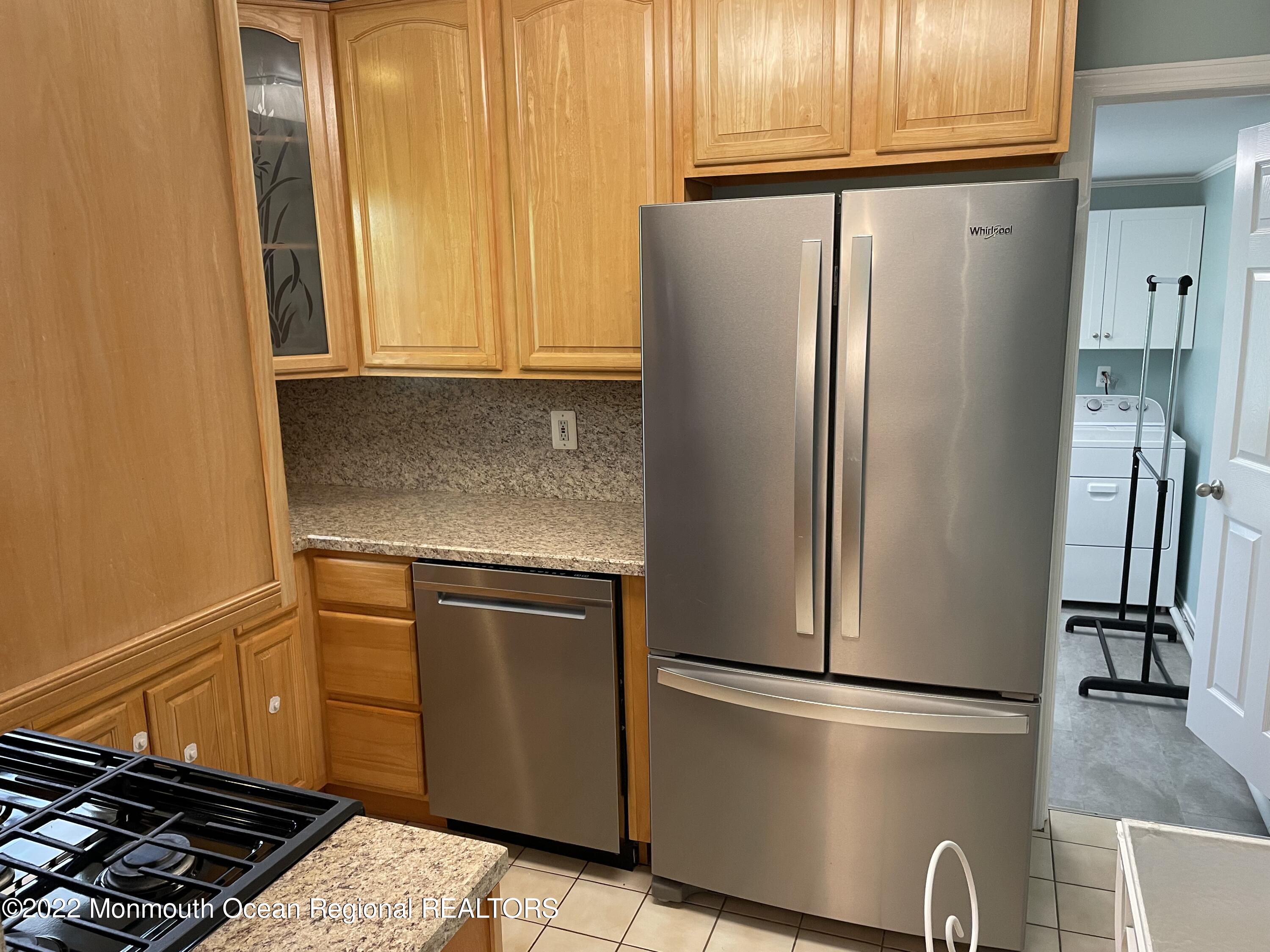 300 4th Avenue Spring Lake, NJ 07762 - Photo 13 of 40 a kitchen with metallic refrigerator freezer and a dishwasher