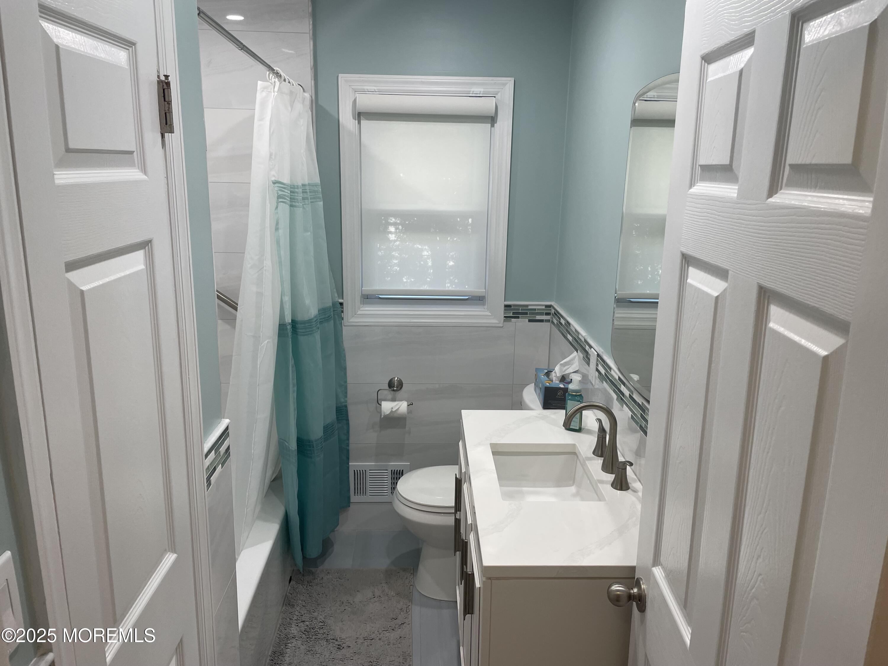 300 4th Avenue Spring Lake, NJ 07762 - Photo 16 of 40 a bathroom with a sink toilet and shower