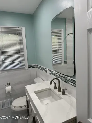 a bedroom with a bed and a table in it