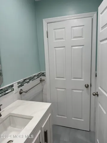 kids bedroom with a bed and wooden floor