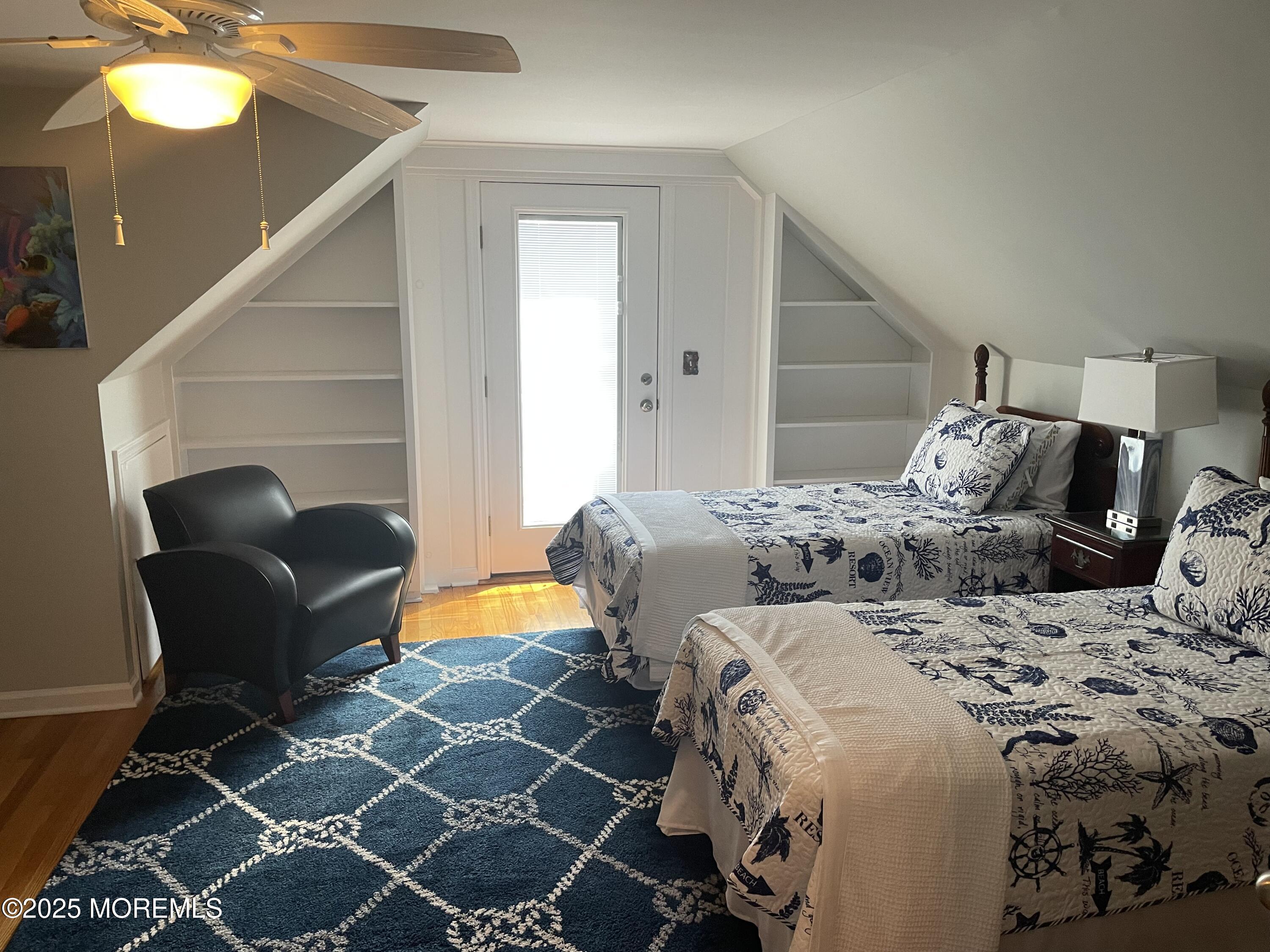 300 4th Avenue Spring Lake, NJ 07762 - Photo 28 of 40 a bedroom with a bed and wooden floor