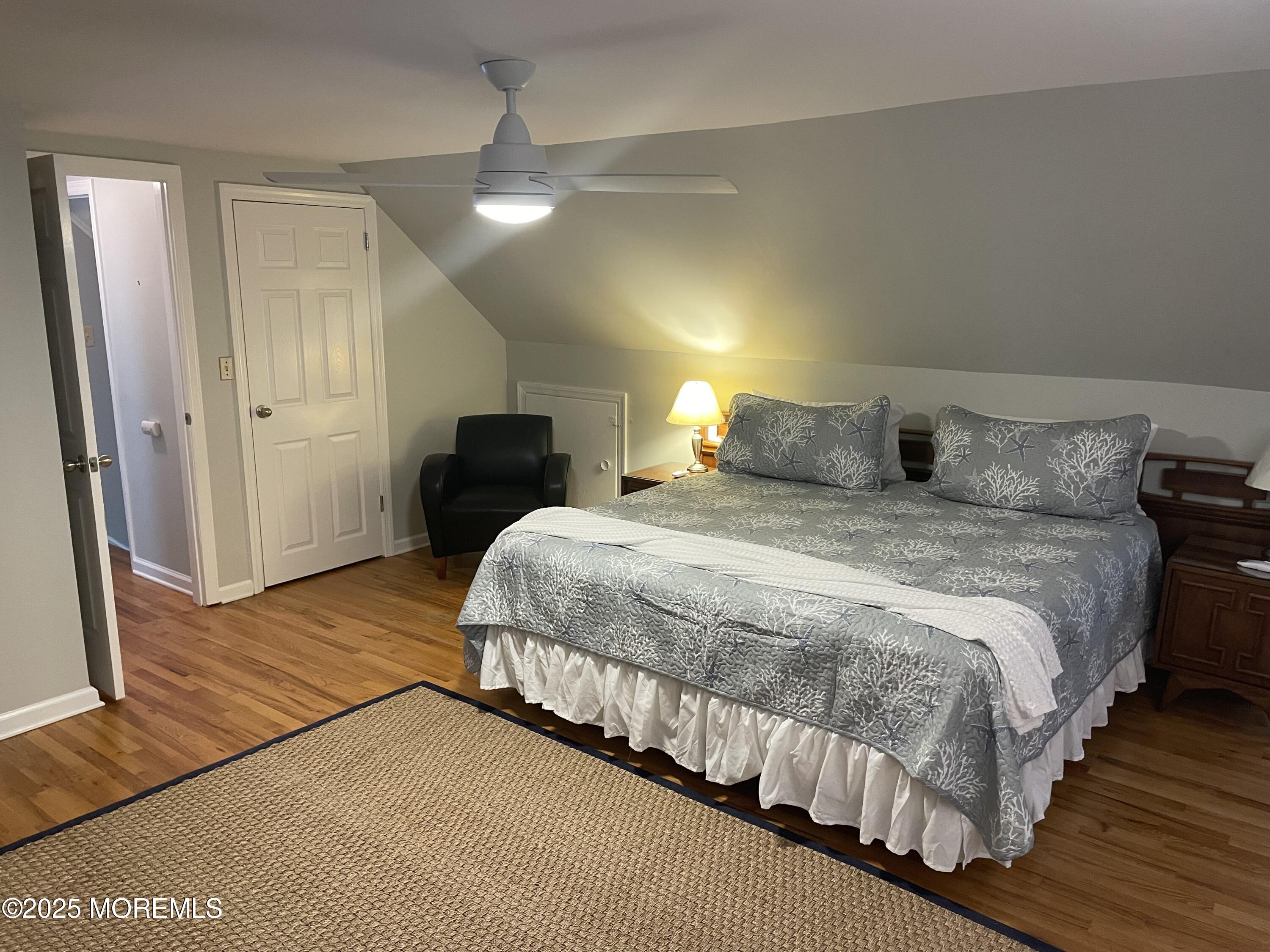 300 4th Avenue Spring Lake, NJ 07762 - Photo 38 of 40 a bedroom with a bed and wooden floor