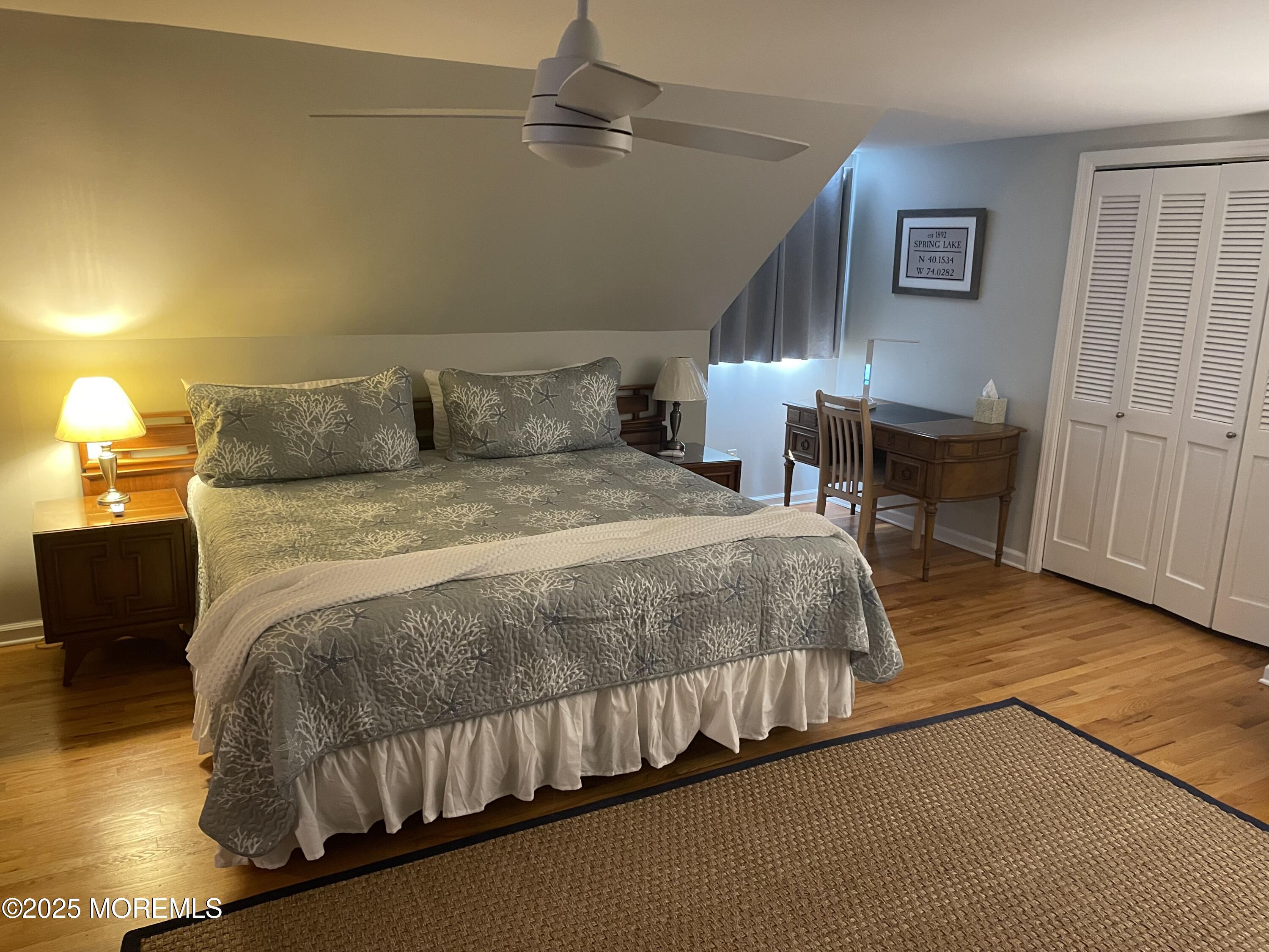 300 4th Avenue Spring Lake, NJ 07762 - Photo 39 of 40 a bedroom with a bed and a table in it