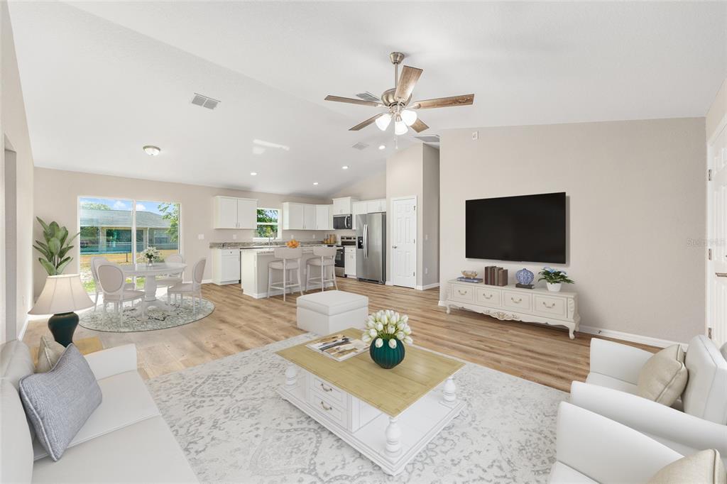 17654 Southwest 112th Lane Dunnellon, FL 34432 - Photo 2 of 17 a living room with furniture and a flat screen tv
