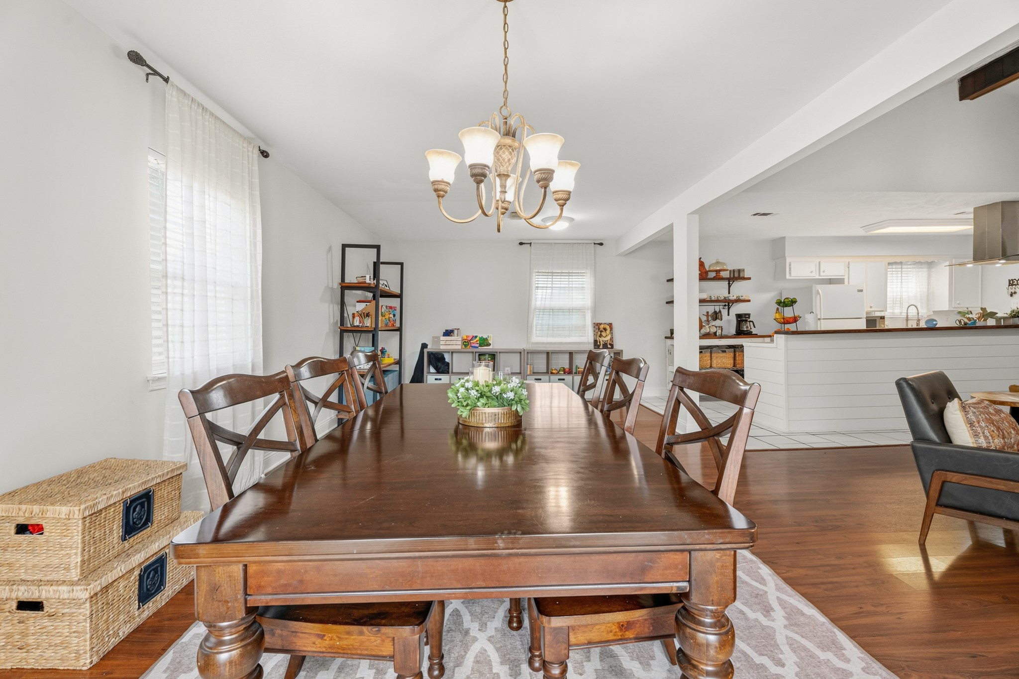 2104 Rose Road Pearland, TX 77581 - Photo 21 of 43 a view of a dining room with furniture and wooden floor