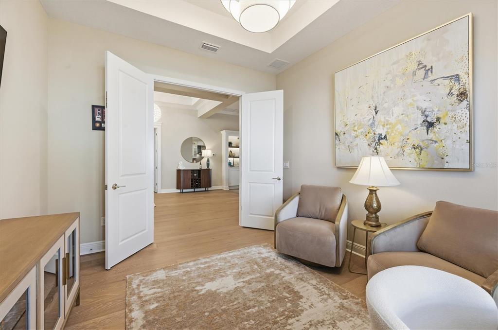 15909 Castle Park Terrace Lakewood Ranch, FL 34202 - Photo 19 of 66 a living room with furniture and a fireplace