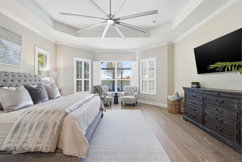 15909 Castle Park Terrace Lakewood Ranch, FL 34202 - Photo 20 of 66 a bedroom with a bed and a flat screen tv