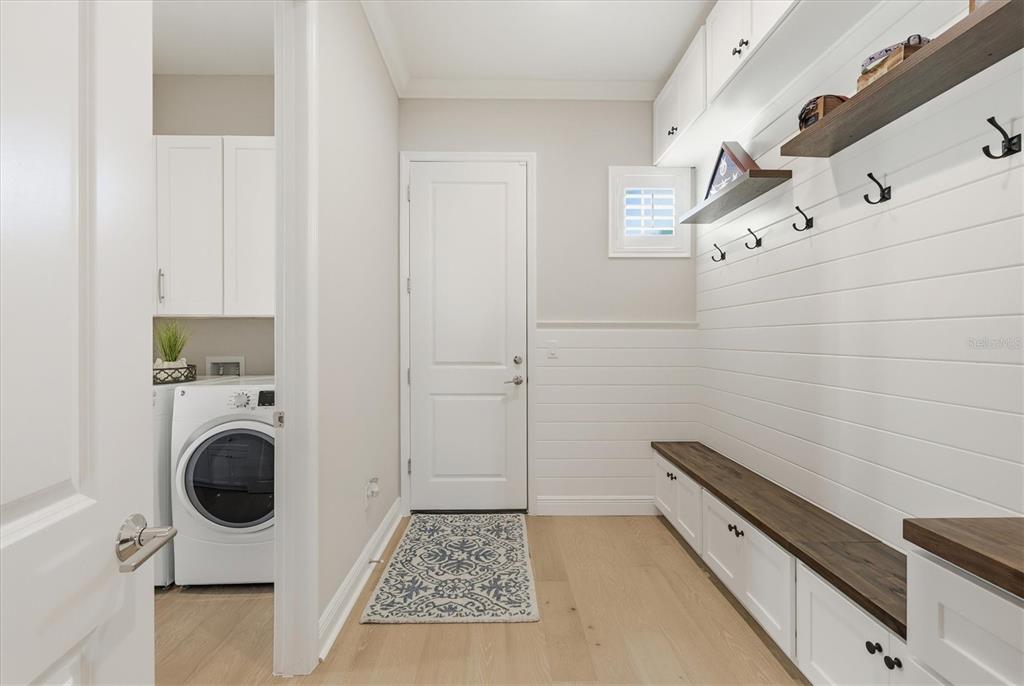 15909 Castle Park Terrace Lakewood Ranch, FL 34202 - Photo 30 of 66 a view of a kitchen with sink and washer dryer