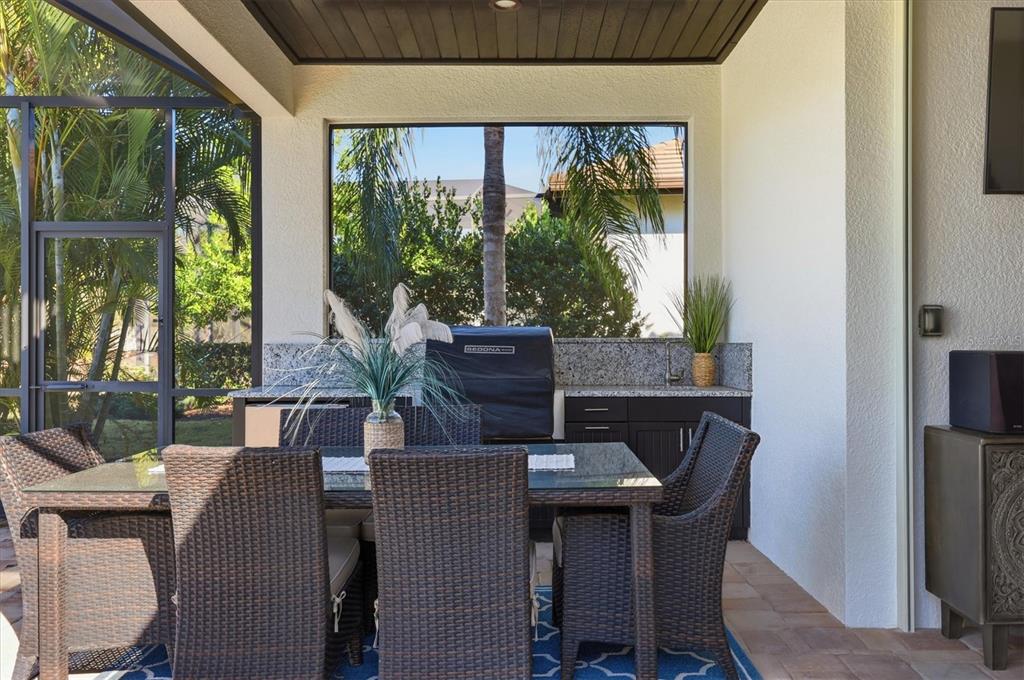 15909 Castle Park Terrace Lakewood Ranch, FL 34202 - Photo 36 of 66 a view of a dining room with furniture window and outside view