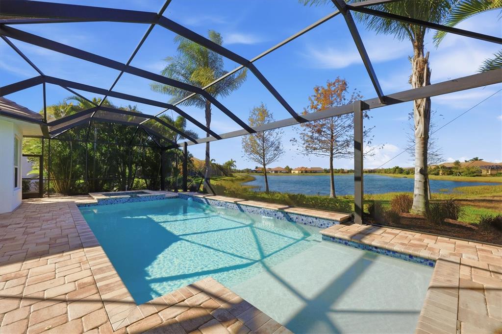 15909 Castle Park Terrace Lakewood Ranch, FL 34202 - Photo 40 of 66 a view of a swimming pool with a porch