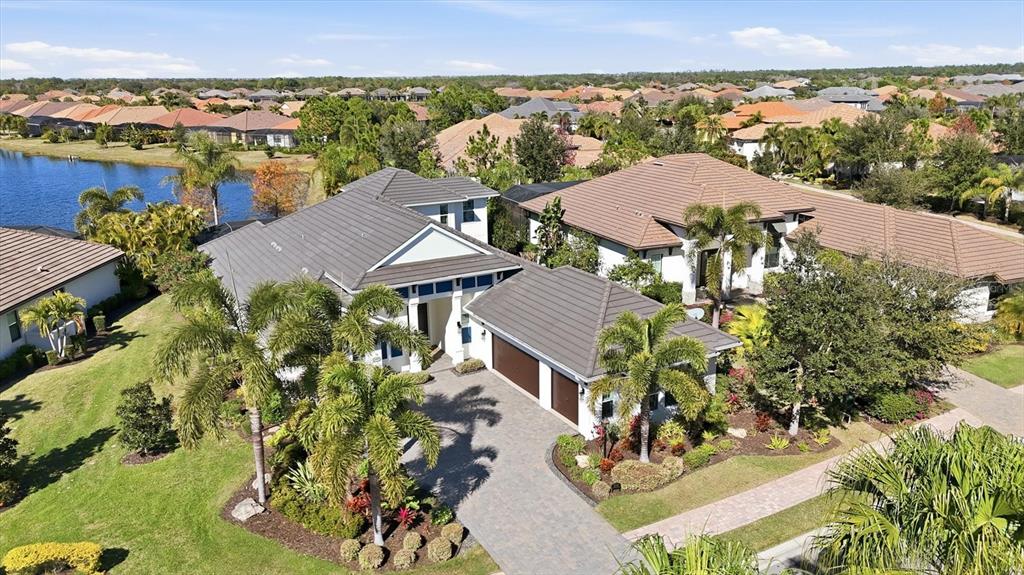 15909 Castle Park Terrace Lakewood Ranch, FL 34202 - Photo 48 of 66 an aerial view of a house with yard swimming pool and outdoor seating