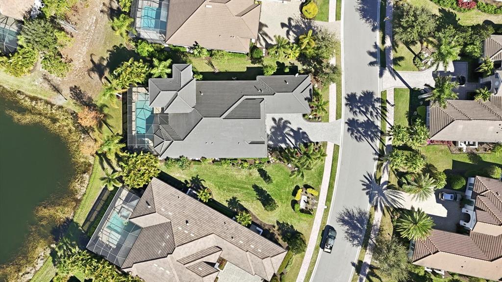 15909 Castle Park Terrace Lakewood Ranch, FL 34202 - Photo 49 of 66 an aerial view of a house with a yard and garden