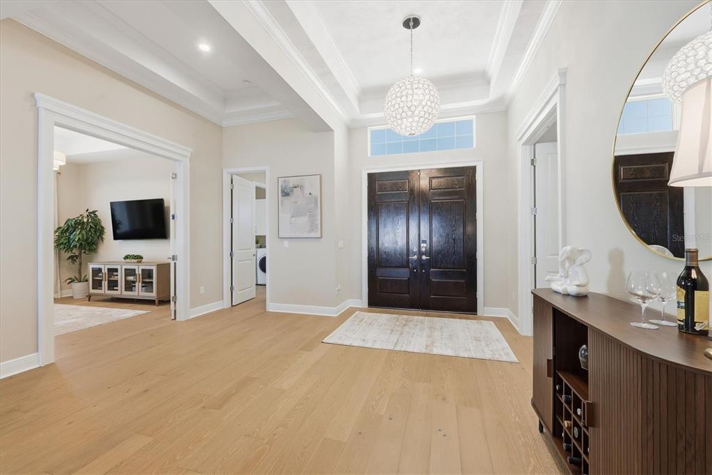 15909 Castle Park Terrace Lakewood Ranch, FL 34202 - Photo 5 of 66 a view of a hallway with bathroom and mirror