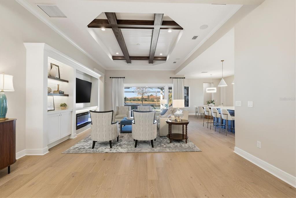 15909 Castle Park Terrace Lakewood Ranch, FL 34202 - Photo 6 of 66 a living room with furniture and a flat screen tv