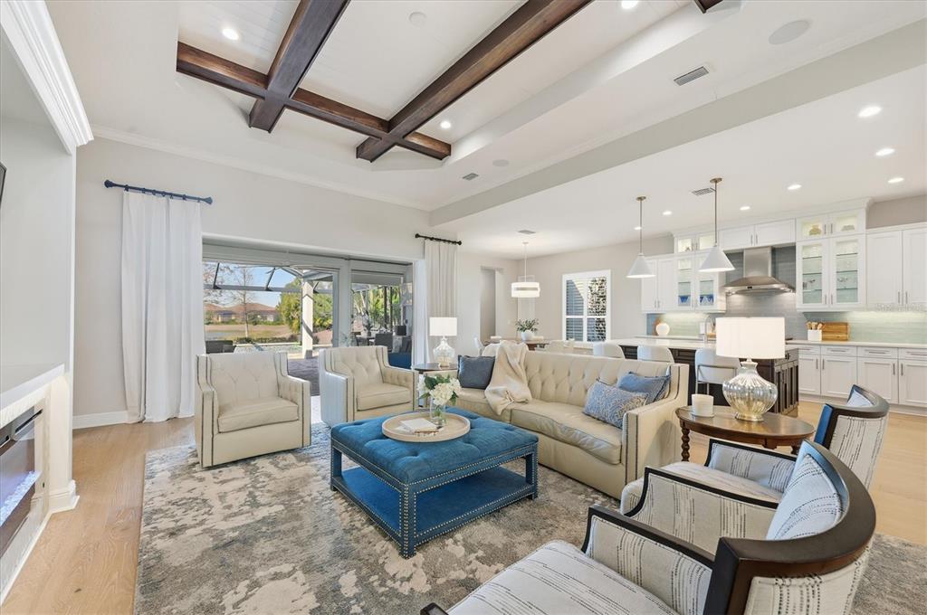 15909 Castle Park Terrace Lakewood Ranch, FL 34202 - Photo 7 of 66 a living room with furniture and a large window