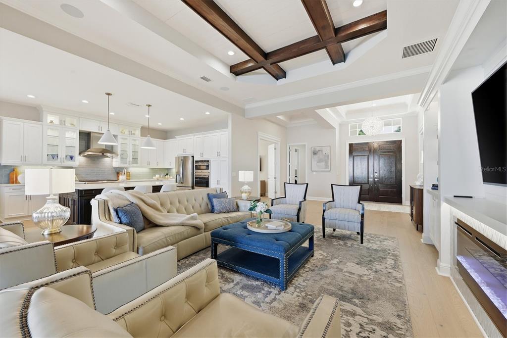 15909 Castle Park Terrace Lakewood Ranch, FL 34202 - Photo 8 of 66 a living room with furniture and a flat screen tv
