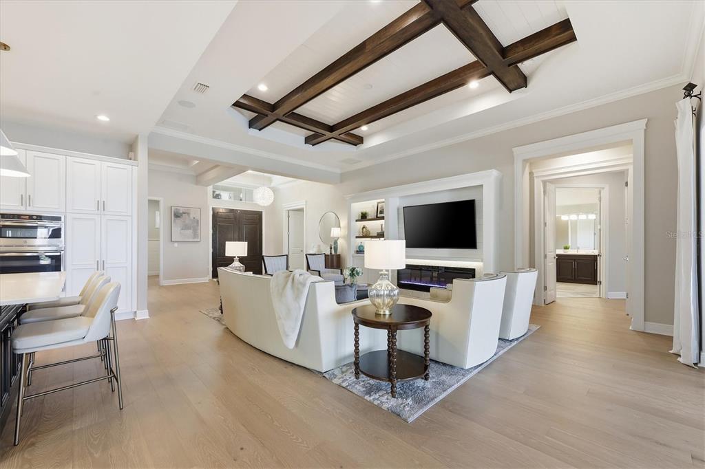 15909 Castle Park Terrace Lakewood Ranch, FL 34202 - Photo 9 of 66 a living room with furniture and a flat screen tv