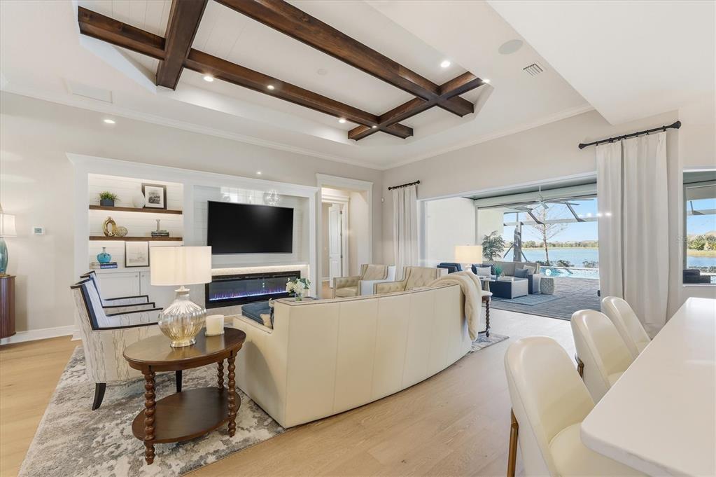 15909 Castle Park Terrace Lakewood Ranch, FL 34202 - Photo 10 of 66 a living room with furniture and a flat screen tv