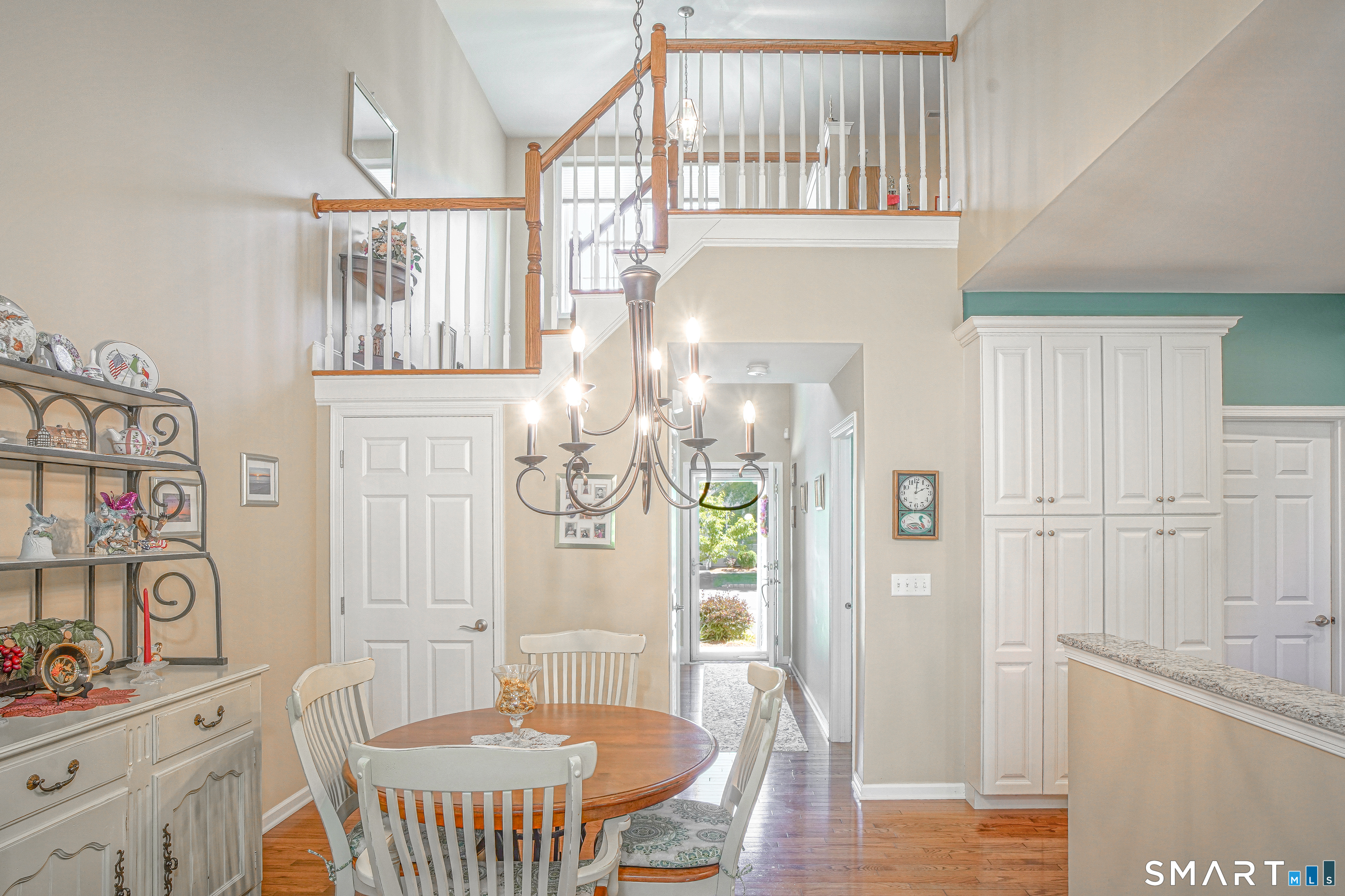 6 Lilac Lane, Unit 6 Prospect, CT 06712 - Photo 37 of 40 Enjoy the bright open floor plan with soaring ceilings and a view of the railed stairway to the upper rooms