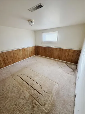 a view of house with a yard