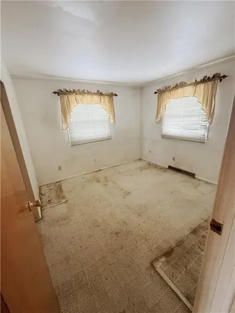 a bathroom with a granite countertop sink a toilet and bathtub