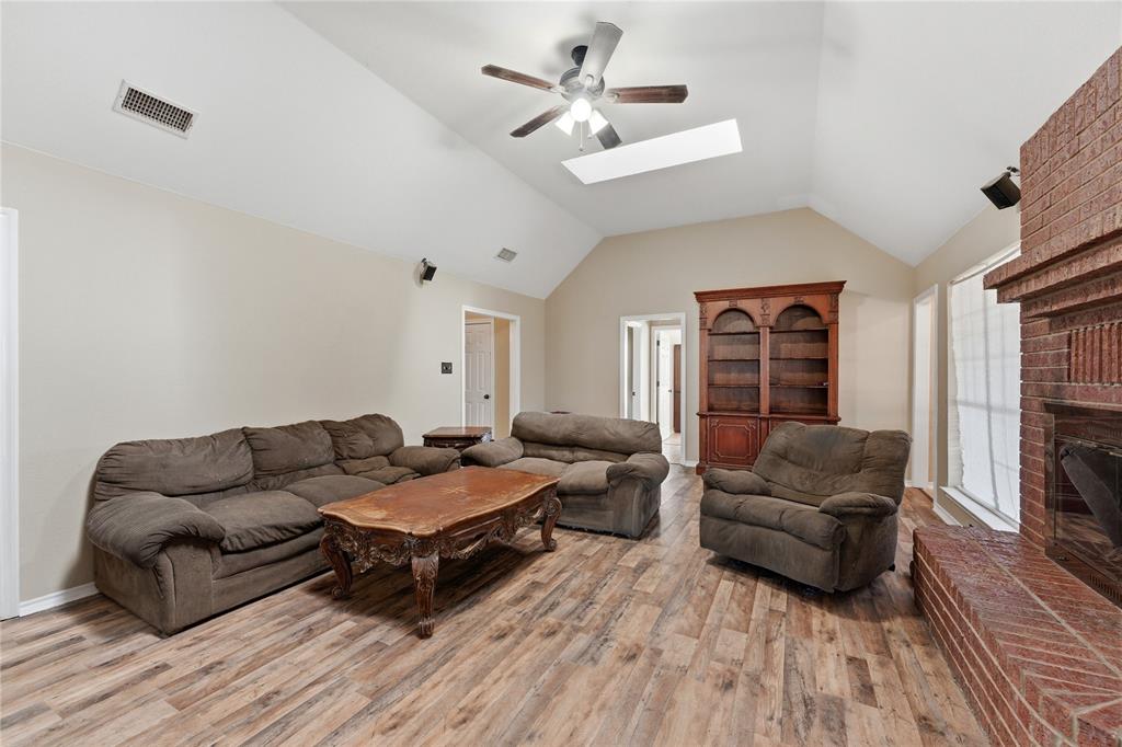 14529 County Road 511 Venus, TX 76084 - Photo 11 of 33 Living area featuring a ceiling fan, light wood finished floors, and a skylight