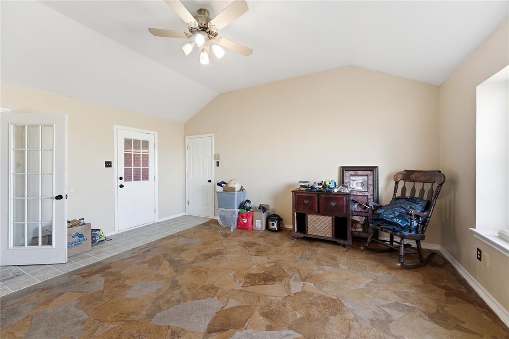 14529 County Road 511 Venus, TX 76084 - Photo 12 of 33 Sitting room featuring ceiling fan and light stone finish floors