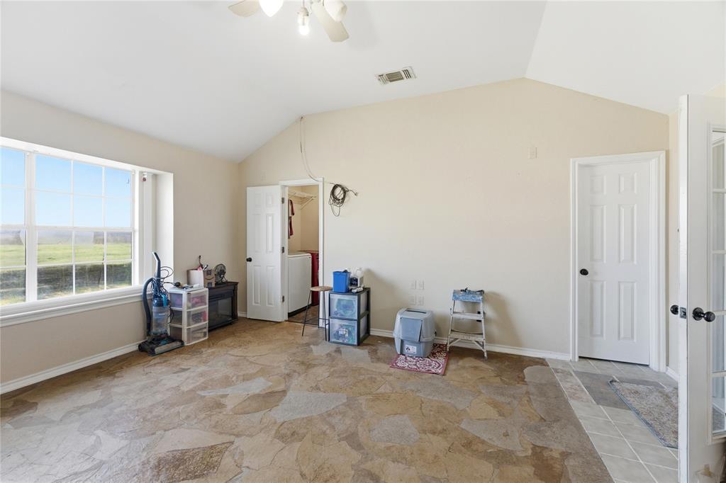 14529 County Road 511 Venus, TX 76084 - Photo 13 of 33 Bedroom featuring lofted ceiling and ceiling fan