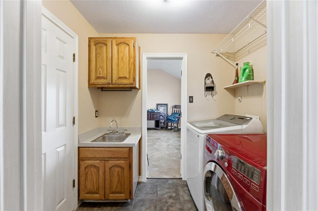 14529 County Road 511 Venus, TX 76084 - Photo 15 of 33 Laundry area with washing machine and clothes dryer and cabinet space