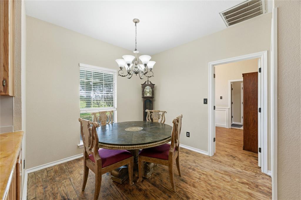 14529 County Road 511 Venus, TX 76084 - Photo 17 of 33 Dining room featuring wood finished floors and suspended lighting