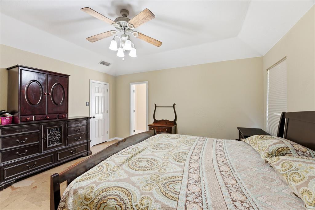 14529 County Road 511 Venus, TX 76084 - Photo 21 of 33 Bedroom with ceiling fan, light colored carpet, and vaulted ceiling