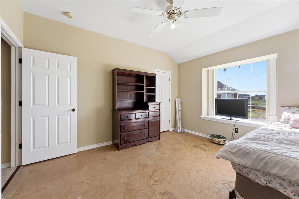 14529 County Road 511 Venus, TX 76084 - Photo 23 of 33 Bedroom with lofted ceiling and a ceiling fan