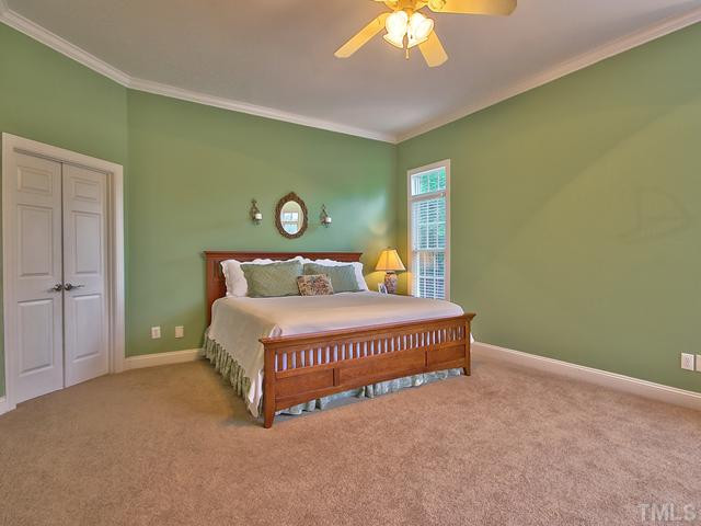1812 Stannard Trail Raleigh, NC 27612 - Photo 11 of 25 The first floor master retreat is located in the rear of the home for added privacy. Features include windows with transoms, crown molding and a ceiling fan. Master Suite