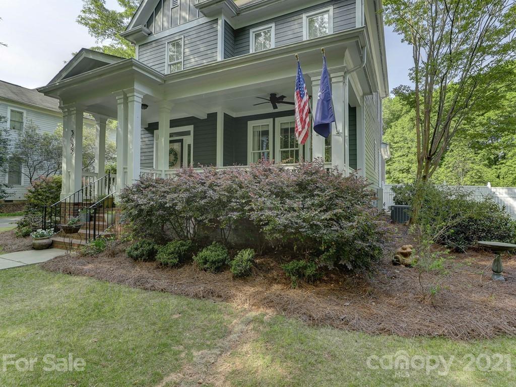 3035 Colonel Springs Way Fort Mill, SC 29708 - Photo 3 of 48 a view of a brick house with many windows and plants