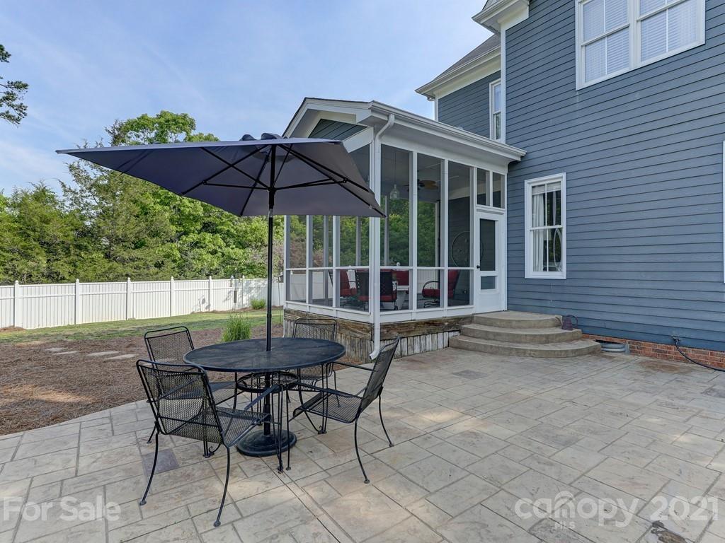 3035 Colonel Springs Way Fort Mill, SC 29708 - Photo 45 of 48 a backyard of a house with table and chairs