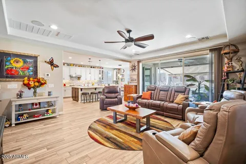 a living room with furniture fireplace and a flat screen tv