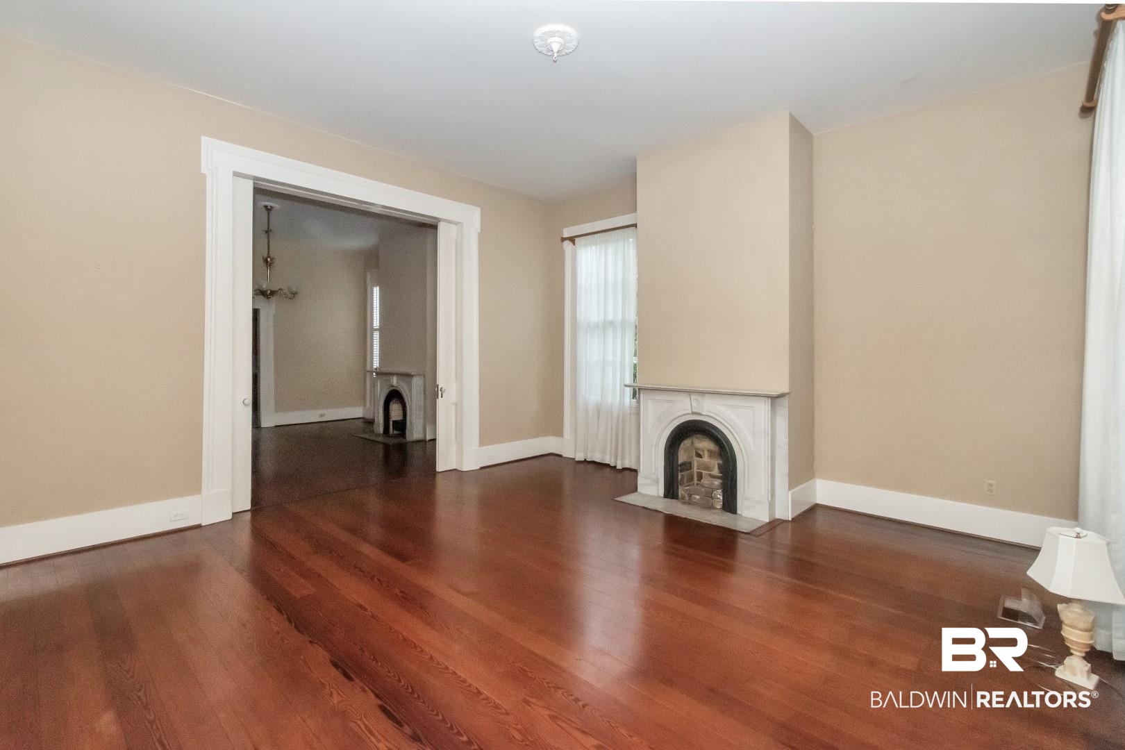 959 Dauphin Street Mobile, AL 36604 - Photo 3 of 43 Unfurnished living room with wood-type flooring
